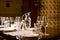 Wineglasses and glass jugs on a table ready for wine testing in a restaurant