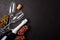 Wineglasses, grapes and bottle of champagne lying on black wooden background. New Year celebration concept. Top view. Flat lay