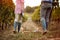 Winegrower couple in vineyard tasting wine