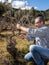 Winegrower works at pruning in an old vineyard