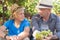 Winegrowers in straw hats relaxing in garden