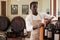 Winemaker arranging bottles in wine shop