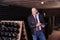 Winemaker with clipboard in wine cellar