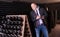 Winemaker with clipboard in winery vault