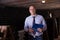 Winemaker with clipboard in winery vault