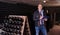 Winemaker with clipboard in winery vault