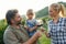 Winemaker family together in vineyard