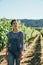 Winemaker walking in grape field