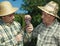 Winemakers tasting grapes.