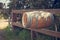 Winery barrel as mail post box on fence