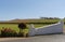 Winery entrance and a vineyard in Western Cape, South Afric