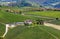 Winery and green vineyards on the hill in Italy.