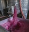 Winery producing wine, Grape ju in tank. Wine fermentation tanks. Wine fermentation process Red grapes in fermentation tank.