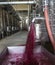 Winery producing wine, Grape ju in tank. Wine fermentation tanks. Wine fermentation process Red grapes in fermentation tank.