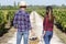 winery vineyard tourists couple walking on wine farm tour