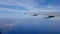 Wing of an airplane flying above the morning clouds plane wing airplane Wing of an airplane flying above the clouds. people looks