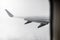 Wing of an airplane in rainy weather. The photo was taken from the window of the plane.