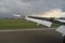 Wing of a airplane with reverse thrust engaged while landing.