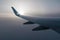 Wing of airplane and sun in fog