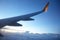 Wing passenger aircraft in flight over the evening clouds