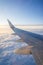 Wing passenger planes, blue sunny sky and clouds. Travel concept.