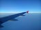 Wing of the plane against the horizon. Air, heaven and earth