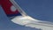 Wing from plane window of Nepal Airlines seen while flying