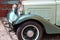 Wing, wheel and headlight of a 1932 vintage car parked in Fortaleza de Sao Tiago in Funchal