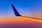 The wing with winglet of plane at sunset