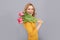 winking happy lady hold flowers for spring holiday on grey background