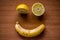 Winking smile made of fruits, lemon and banana