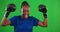 Winner, boxing and sports with black woman on green screen for fitness, success and fight. Workout, exercise and
