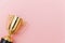 Winner or champion gold trophy cup  on pink pastel colorful background