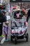 The winner of the marathon fixes the finish time. Woman athlete looks at the clock. The winner of the race meets her daughter