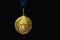 The winner`s gold medal for the first place. Isolated on a black background. place for text.