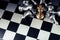 Winner. top view gold king chess with silver chess pawns pieces on chess board game competition on dark background, chess battle,