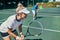 Winners never lose their focus. an attractive young female tennis player playing together with a male teammate outdoors