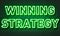 Winning strategy neon sign on brick wall background.