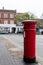 Winslow, Buckinghamshire, United Kingdom, October 25, 2016: Royal Mail red post box on Market Square, Winslow.