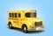 Wintage toon yellow school bus 3d illustration on blue gradient