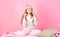 Winter accessory concept. Girl long hair dreamy mood pink background. Kid smiling wear knitted accessory. Kid girl wear