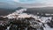 Winter aerial view of mountain landscape and large meadow at Jizerka settlement,Czech republic. Winter nature in cloudy day.Peat