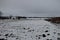 Winter agricultural field in snow, overcast weather