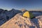 Winter alpine camping in a tent on snow