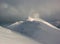 Winter alpine landscape, huge amount of blown snow, danger of snow avalanche.