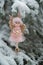 Winter angel on a snowy tree. Snow fairy.Christmas and New Years . Christmas symbol.Christmas tree toy.