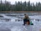 Winter angler fishing on ice
