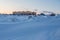 Winter arctic landscape. View of a small arctic village on the shores of the frozen sea.