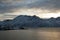 Winter arctic sunset over water with mountains in background