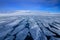 Winter Arctic. White snowy mountain, blue glacier Svalbard, Norway. Ice in ocean. Iceberg in North pole. White clouds on blue sky